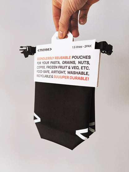 Reusable food pouch held by a hand with text on a white background